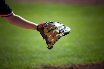 close-up of first baseman's glove reaching out