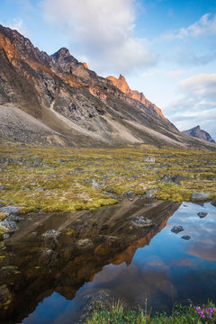 Reflection of alpenglow on mountains in Akshayak Pass, Baffin Island.
