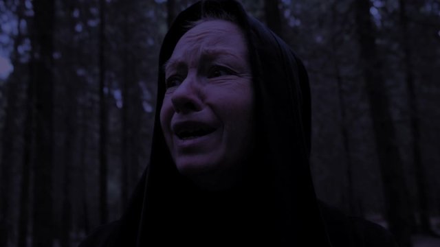 Portrait frightened woman lost in forest.
