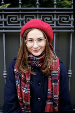 young french millennial girl in beret and coat