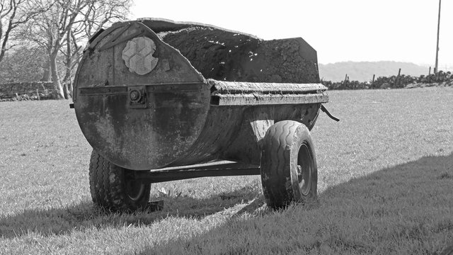 Old Tractor Muck Spreader On Farm In Ireland
