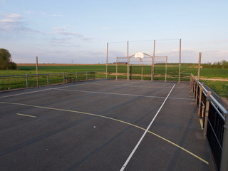basketball court in the background of the setting sun, top view, free space for inscriptions, sad view of empty basketball courts