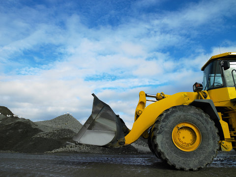 sideview of bulldozer in quarry