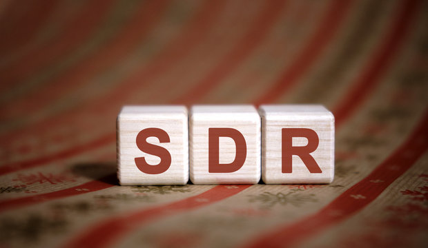 SDR Serpstat Domain Rank - concept on wooden cubes on a striped background