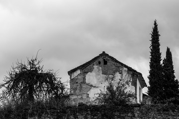 Abandoned house in black and white on a stormy day