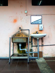 Washbasins and mirror on the street in Malaysia