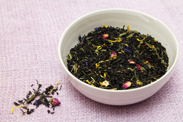 A mixture of black and green leaf tea, with pieces of fruit, rose and cornflower petals, buds and petals of Chinese roses, grapes, apples, from Sri Lanka