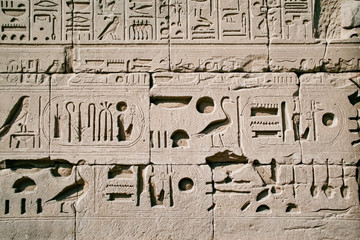 Luxor, Karnak Temple. Egyptian hieroglyphs on the wall of ancient temple