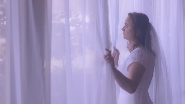 Young Woman Looking Out Window On Wedding Day | Cinematic Gimbal 60P