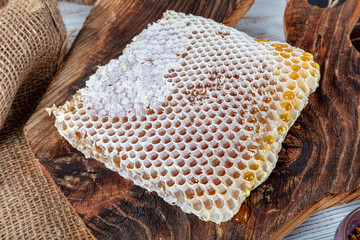 Closeup raw organic Honeycombs . Newly pulled honey bee honeycomb beeswax. Organic honeycomb...