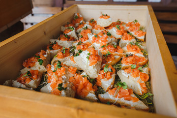 Canapes and sandwiches with red fish were prepared for the event's visitors. The Breakfast is very delicious.