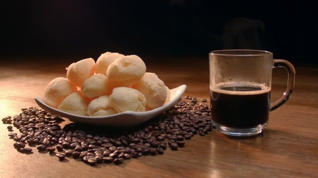 Brazilian cheese bread. Breakfast table with cheese bread, coffee, sugar and cake
