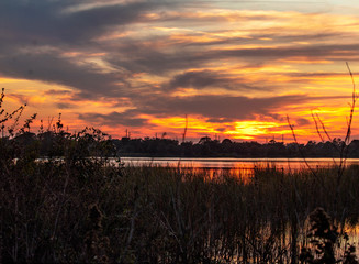 Obraz na płótnie Canvas sunset over the lake, sky, sun, water, landscape, clouds, orange, reflection, dusk, horizon