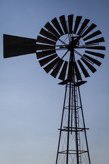 old windmill on blue sky background