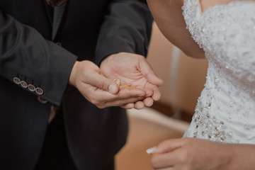 bride and groom holding hands