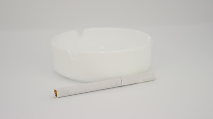 cigarette with an ashtray white background
