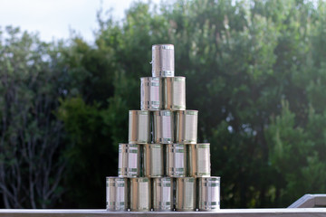 Tinned goods stacked into a pyramid shape. 