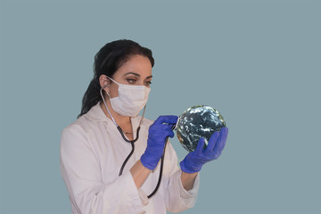 Female doctor putting coronavirus vaccine to planet Earth. Elements of this image are furnished by NASA