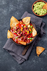 Mexican black bean soup with homemade fried tortillas totopos nachos served with guacamole