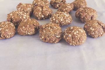 topview of homemade oat cookies on bakery paper