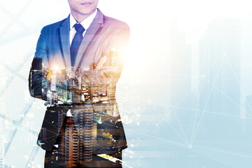 Double exposure image of businessman with city view.The boss have vision and leadership for...