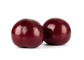 Fresh America red plum isolated on white background.