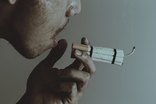 Man smoker.Cigarette like time bomb.Cigarettes is addictive to be cancer.smoking reduction campaign in World No Tobacco Day.