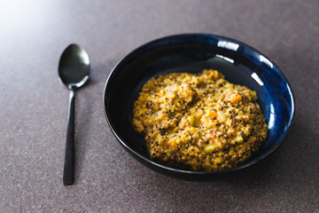 plant-based food, vegan creamy quinoa with cauliflower sauce and chopped celeri and carrots