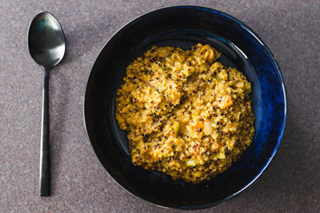 plant-based food, vegan creamy quinoa with cauliflower sauce and chopped celeri and carrots