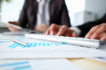 Fototapeta premium Financial statistics documents ball pen infographics at office table closeup. Internal Revenue Service inspector sum check investigation exchange market earnings savings loan and credit concept
