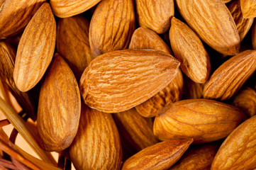 Almonds nuts shot large on a wooden background. Background for healthy eating and vegetarianism.
