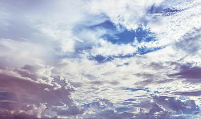 Blue sky with soft purple light on cloudy