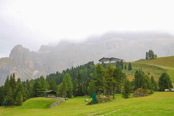 Dolomitic massif in the Italian Dolomites with cloudy sky. Italy.