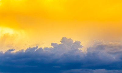 bright yellow sun light on sky with dim blue cloudy