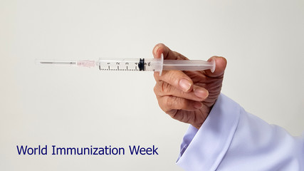 Doctor vaccinating on world immunization week. Vaccine used for vaccination from disease as flu or...
