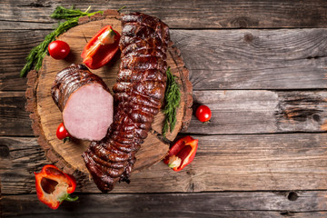 Christmas smoked gammon on wooden board with spices. Rustic style. banner menu place for text