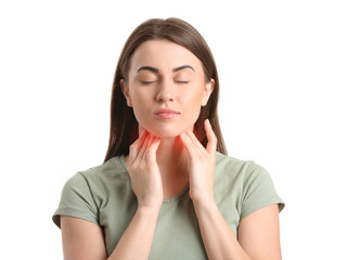 Young woman checking thyroid gland on white background