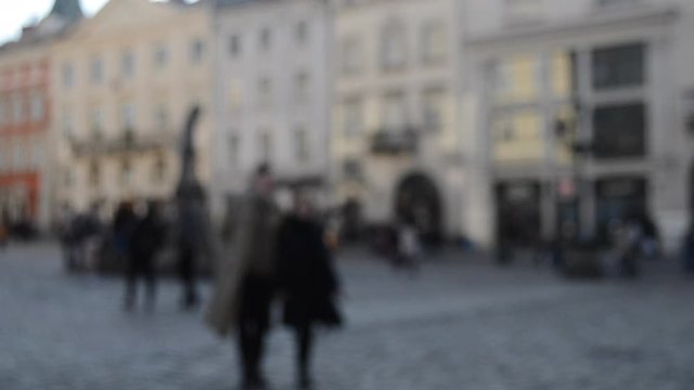 Abstract Defocused Blurred Background of many people on street square