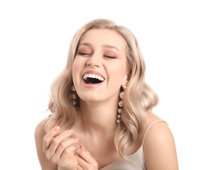 Young blonde with beautiful hair on white background