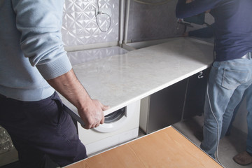 Installation of modern kitchen furniture.