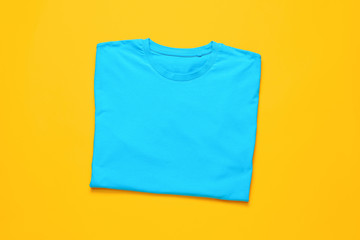 Stylish t-shirt on color background