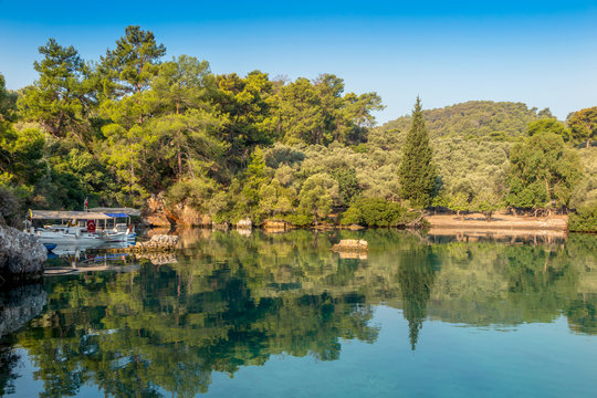 Reflections in the still waters of Kapi Creek, Gocek, Turkey