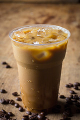 ice coffee latte in glass on wooden table