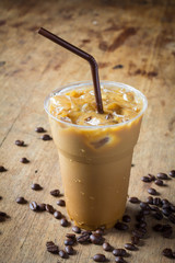 ice coffee latte in glass on wooden table