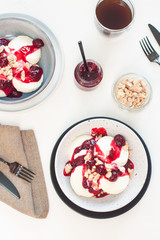 Cottage cheese pancakes with berry sauce and nuts. Healthy breakfast concept.