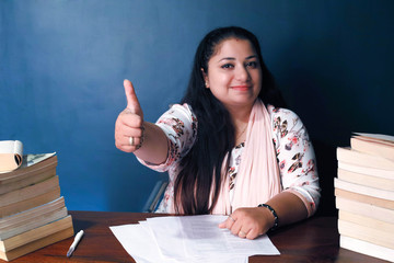 Indian teacher wishing best of luck to the students for their exams.