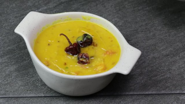 Cooking Pulses or lentils for Daal Tadka, an Indian lentils soup dish.