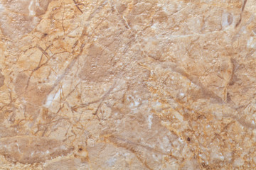 Texture of light brown marble with pattern, macro background. Beige stone backdrop from mineral tile.