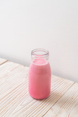 pink milk or strawberry milk in bottle