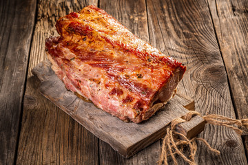 roasted pork on rustic wooden cutting board, top view banner menu recipe place for text